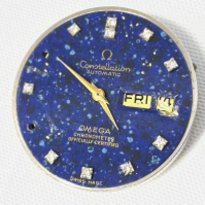 An Omega Star Dust Dial set with diamonds, some stones missing and some damage. Postage category A