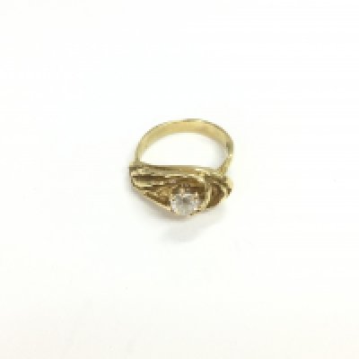 An unusual 18ct gold solitaire ring set with a diamond approx 0.47cts. Approx weight 7.30 grams, approx size J 1/2.