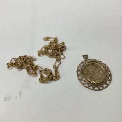 A 9ct gold sovereign medallion with a 9ct gold chain. Approx 7.45 grams.