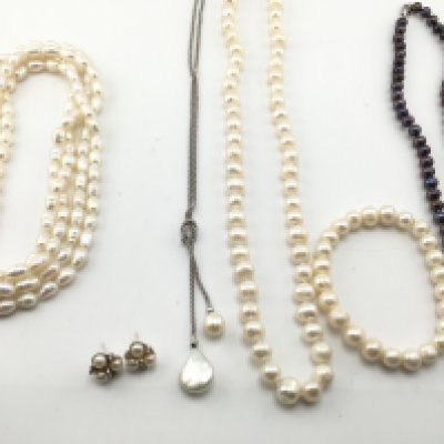 A collection of assorted pearl jewellery items including necklaces and earrings etc Postage B