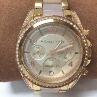 Michael Kors rose and ceramic round face watch with box and papers. Seen working. Postage B