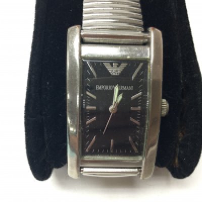 A stainless steel Emporio Armani watch on stretch bracelet. Seen running. Comes with box and papers. Postage B