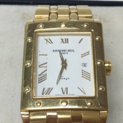 A Raymond Weil white dial tango gold plated watch. Come with box. Postage B