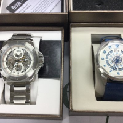 Two gents automatic wrist watches both in excellent condition with box and paperwork. Both seen running. Postage B