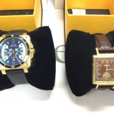A pair of gents automatic wrist watches both with boxes and in good condition seen running. Postage B
