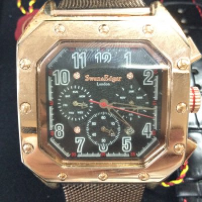 A gents Swan and Edgar automatic watch seen running with box and papers. Postage B