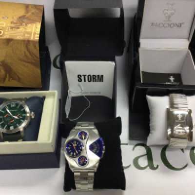 Three gents watches including Storm and Pacconi etc. All with boxes and paperwork. Postage B