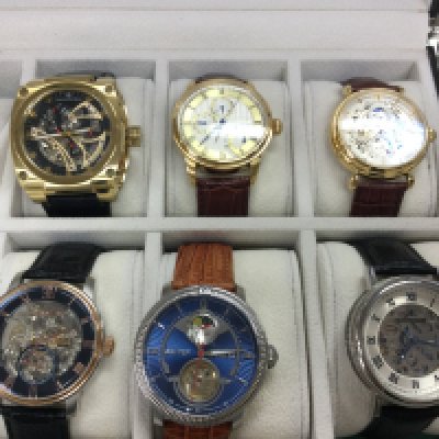 A small collection of watches including Earnshaw etc all in a 10 watch storage box. Postage B