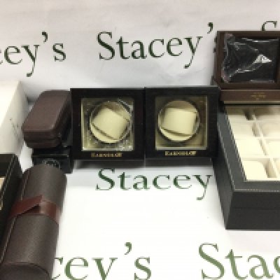 A collection of Watch accessories including to watch winders a travel watch roll and a 10 watch box etc. Postage B