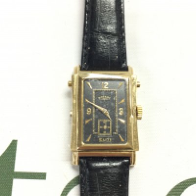 A Rotary elite reverse face watch on black leather strap. Postage B