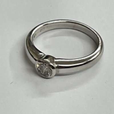 18ct white gold single stone rub over set ring. Approx ring size J. 0.40ct, 3.52g. Postage category A.