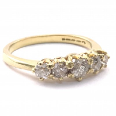 A 14 carat gold five stone moissanite set ring , total weight 3.47g. Postage category A
