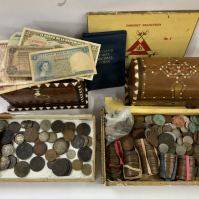 A large collection of mixed world coinage and banknotes. (A)