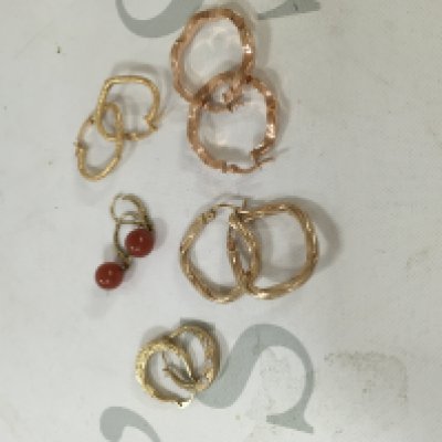 A small collection of 9ct gold hoops. Approx weight 8.47 grams.