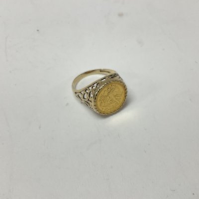 A 9ct gold coin set ring approx weight 4.8 grams. Size R.