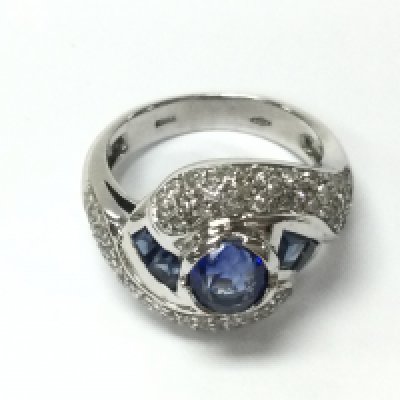 An 18ct white gold ring set with sapphires and diamonds. Size J and 6.90g. Postage B