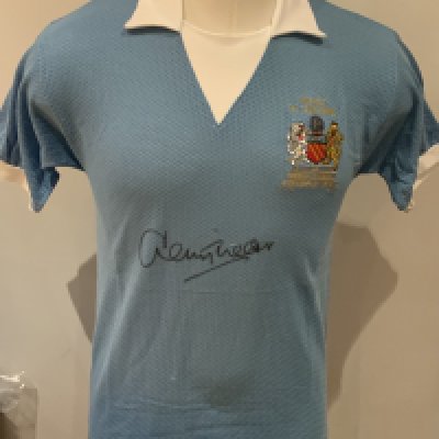 Manchester City 1976 League Cup Final Signed Replica Shirt: Blue short sleeve shirt signed to front by winning goal scorer Tueart. COA from reputable source. 