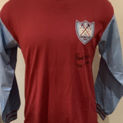 1964 West Ham FA Cup Final Signed Replica Shirt: Long sleeve signed to front by Ron Boyce. COA from reputable source. Boyce has signed The Winner with reverence to his 90th minute winning goal. 
