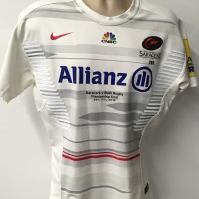 Saracens 2014 - 2015 Away Match Worn Rugby Union Football Shirt: White short sleeve Nike large excellent condition shirt worn by Neil DeKock. Aviva Premiership badging. Worn v Bath on 30 May 2015 in the Premiership final. Player was a second half substitute in the match that Saracens won 28-16. GPS tracking pocket present on the shirt neck.
