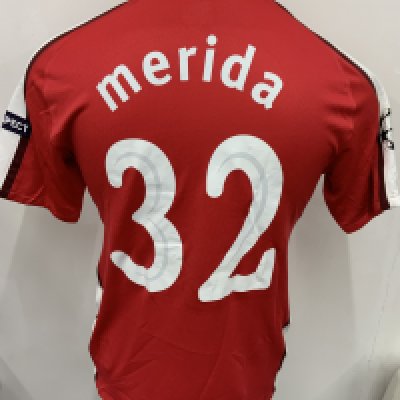 Arsenal 2009 - 2010 Home Match Issued Football Shirt: Red and white short sleeve Nike shirt with Champions League badging to sleeves. Merida 32 to rear.