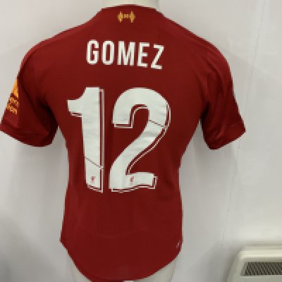 Liverpool 2019 - 2020 Match Issued Football Shirt: Red short sleeve shirt with FA Cup badging to sleeves. Gomez 12 to rear. Shirt also features the Gold FIFA World Champions badge to front centre. 