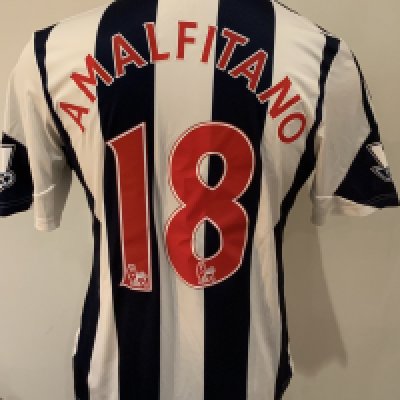 West Brom 2013 - 2014 Match Worn Football Shirt: Blue and white short sleeve shirt with Premier League badges to sleeves. Amalfitano 18 to rear. Worn v Arsenal on 6 October 2013.