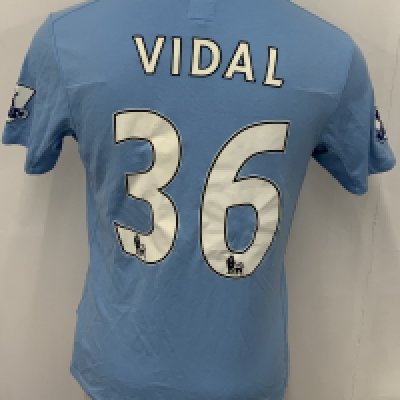Manchester City 2009 - 2010 Vidal Match Issued Football Shirt: Blue short sleeve Umbro shirt from 1st season of Etihad Sponsorship. Premier League badging to sleeve and Vidal 36 to rear. 