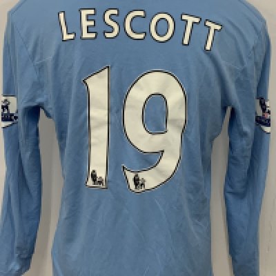 Manchester City 2009 - 2010 Lescott Match Worn Football Shirt: Blue long sleeve Umbro shirt from 1st season of Etihad Sponsorship. Premier League badging to sleeve and Lescott 19 to rear. 