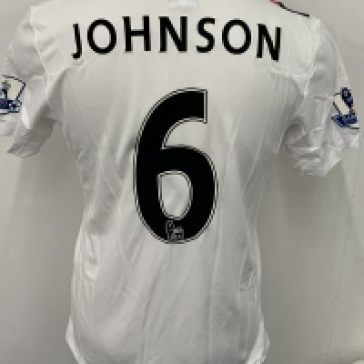 Manchester City 2009 - 2010 M Johnson 3rd Kit Match Issued Football Shirt: White with red and black slash short sleeve Umbro shirt from 1st season of Etihad Sponsorship. Premier League badging to sleeve and Johnson 6 to rear. 
