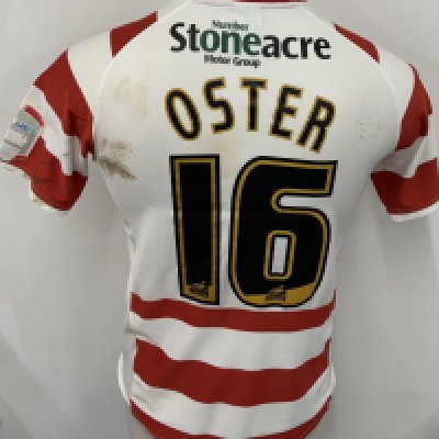 Doncaster Rovers 2010 - 2011 Match Worn Football Shirt: Red and white short sleeve shirt. Number 16 Oster. NPower League badging. Wear to badging and unwashed shirt.