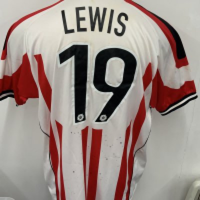 Stevenage 2007 - 2008 Match Worn Football Shirt: Red and White short sleeve shirt. Number 19 Lewis. Signed with dedication. Ink marks bled to rear