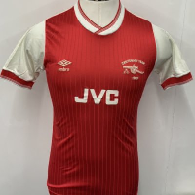 Arsenal 85/86 Home Match Worn Football Shirt: Red short sleeve JVC medium excellent condition shirt worn by Viv Anderson. Embroidered Umbro and Centenary Year 1985 badging. 