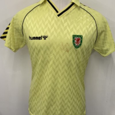 Wales 1987 Match Worn Away Football Kit: Yellow large Hummel short sleeve number 7 with tiny mark and scuff to chest. C/W red shorts from same source but not necessarily worn in same match. 