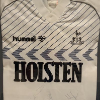 Tottenham 1986 - 1987 Framed Signed Football Shirt: Squad signed to original large Hummel Holsten shirt including Ardiles, Mabbutt and David Pleat. Frame measures approximately 24 inches by 19 inches. Not for posting. 