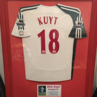 Dirk Kuyt Liverpool 2006 - 2007 Match Worn Framed Football Shirt: White short sleeved away shirt with Premier League badging and Kuyt 18 to rear. Worn in 3-0 win at Watford on 13 1 2007. Beautifully and expensively framed. Not for posting.