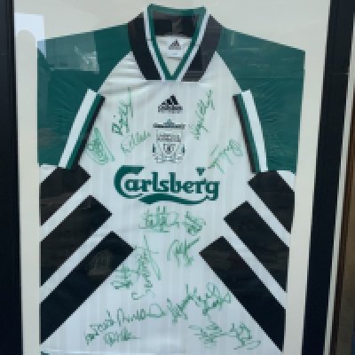 Liverpool 1994 - 1995 Signed Framed Football Shirt: Green and white original Carlsberg size 40-42 away shirt. Multi signed by squad in matching green. Frame measures approximately 38 inches x 28 inches. Not for posting. 
