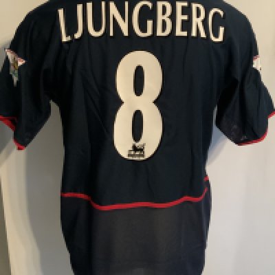 Arsenal 2002 - 2003 Away Match Worn Football Shirt: Blue short sleeve Nike shirt with Premier League Champions 2001 - 2002 badging to sleeves. Ljunberg 8 to rear. Worn v Sunderland on 11 May 2003. Comes with signed COA from the player who scored 3 goals in the match.