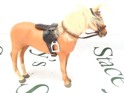 A Julip American Quarter Horse, Palamino With White Mane. Star And 2 White Socks On Back Legs.