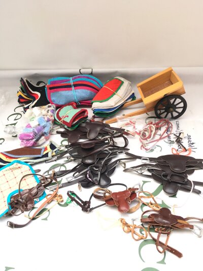 A Collection Of Vintage And Horse Of The Year Julip Horse Tacks Etc And A Vintage Donkey Cart And Harness.