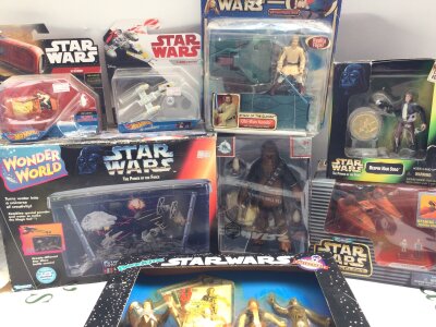 A Collection Of Various Boxed Star Wars Toys And Collectables.
