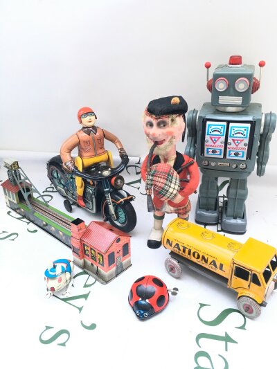 A Collection Of Various Tinplate Toys An A Vintage Wind-up Scotsman With Paper-Mache Head.