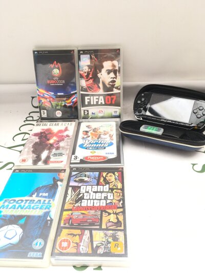 A Sony PSP, With A Collection Of Games. Damage To Battery Compartment. No Reseve.