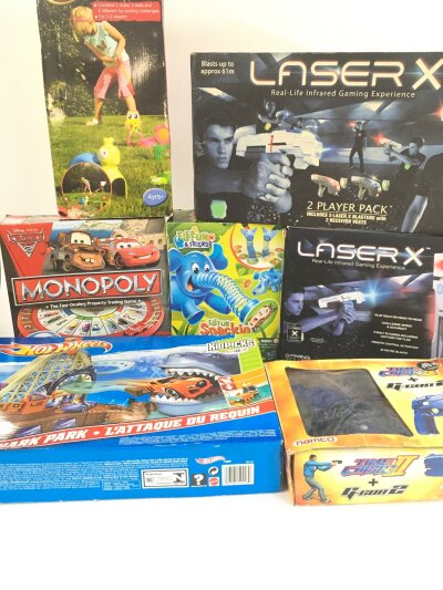 A Collection Of Boxed Board Games, Laser Games, A Baywatch Doll, etc. No Reserve.