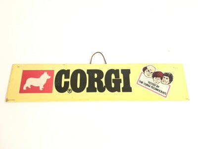 A Laminated Corgi Shop Sign. Aprrox Length 45CM Height 10CM.