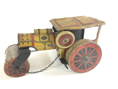 A German Tinplate Steam Roller. Parts Missing and In Need Of Repair.