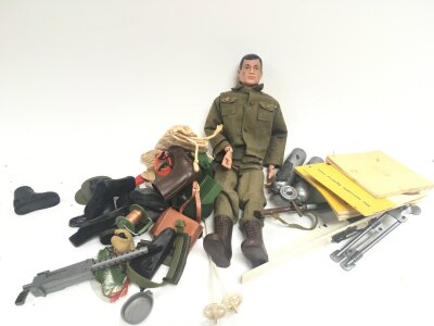 A Vintage Action Man With Some Accessories.