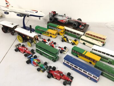 A Collection Of Onyx 1/48 Scale F1 Cars, Model Buses And A Collection Of Empty Boxes To Be Matched. Includes Model Of Jumbo Jet. And 2 Small Display Cabinets Approximate Size 61cm X 61Cm. No Reserve. (4).