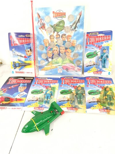 A Collection Of Carded Matchbox Thunderbirds Figures and A Fina Coin Collection.