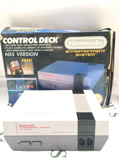 A Boxed Nimtedo Entertainment System. Box Is Worn And Game Pack Is Missing. Nes Version.