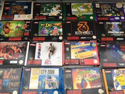 A Collection Of Boxed Super Nintendo Games With Manuals. 30 In Total.